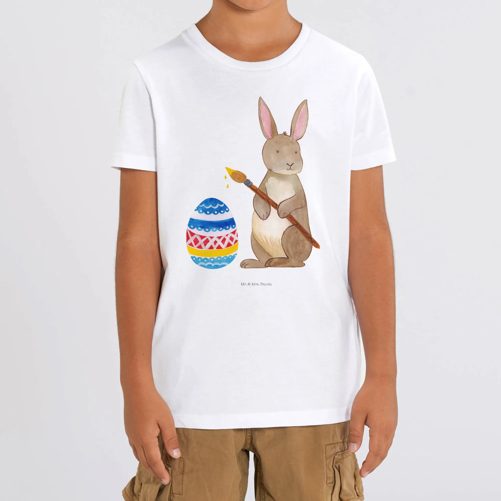 Organic Kinder T-Shirt Hase Eiermalen Kinder T-Shirt, Kinder T-Shirt Mädchen, Kinder T-Shirt Jungen, Ostern, Osterhase, Ostergeschenke, Osternest, Osterdeko, Geschenke zu Ostern, Ostern Geschenk, Ostergeschenke Kinder, Ostern Kinder, Frohe Ostern, Ostergrüße, Osterblume, Osterei, bemalte Ostereier, Hase, Kaninchen, Eiermalen