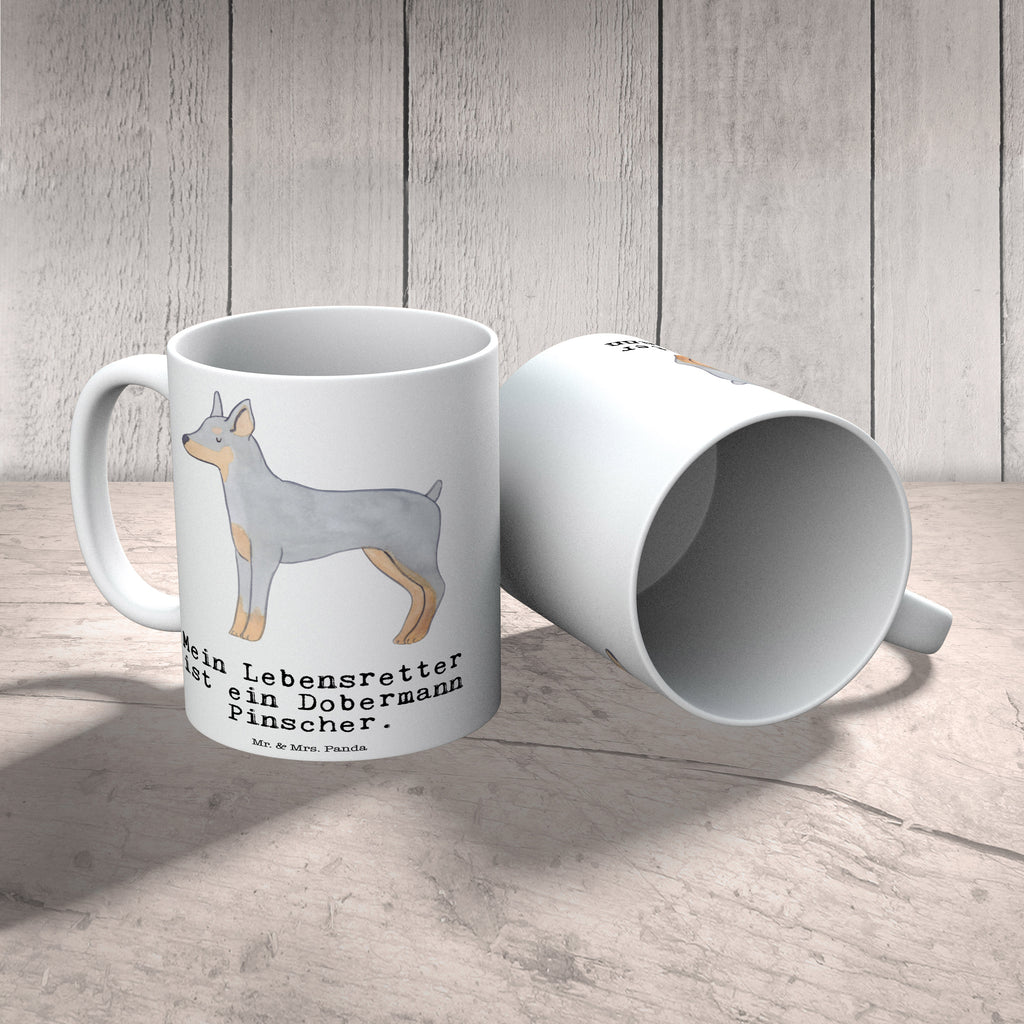 Tasse Dobermann Pinscher Lebensretter Tasse, Kaffeetasse, Teetasse, Becher, Kaffeebecher, Teebecher, Keramiktasse, Porzellantasse, Büro Tasse, Geschenk Tasse, Tasse Sprüche, Tasse Motive, Kaffeetassen, Tasse bedrucken, Designer Tasse, Cappuccino Tassen, Schöne Teetassen, Hund, Hunderasse, Rassehund, Hundebesitzer, Geschenk, Tierfreund, Schenken, Welpe, Dobermann Pinscher