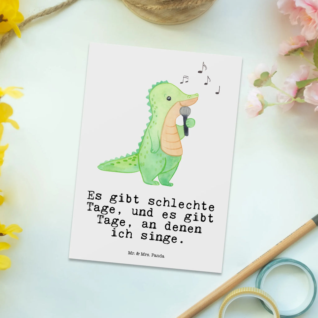 Postkarte Krokodil Singen Postkarte, Karte, Geschenkkarte, Grußkarte, Einladung, Ansichtskarte, Geburtstagskarte, Einladungskarte, Dankeskarte, Ansichtskarten, Einladung Geburtstag, Einladungskarten Geburtstag, Geschenk, Sport, Sportart, Hobby, Schenken, Danke, Dankeschön, Auszeichnung, Gewinn, Sportler, Singen, Band, Live Auftritt, Gesang, Hobbysänger