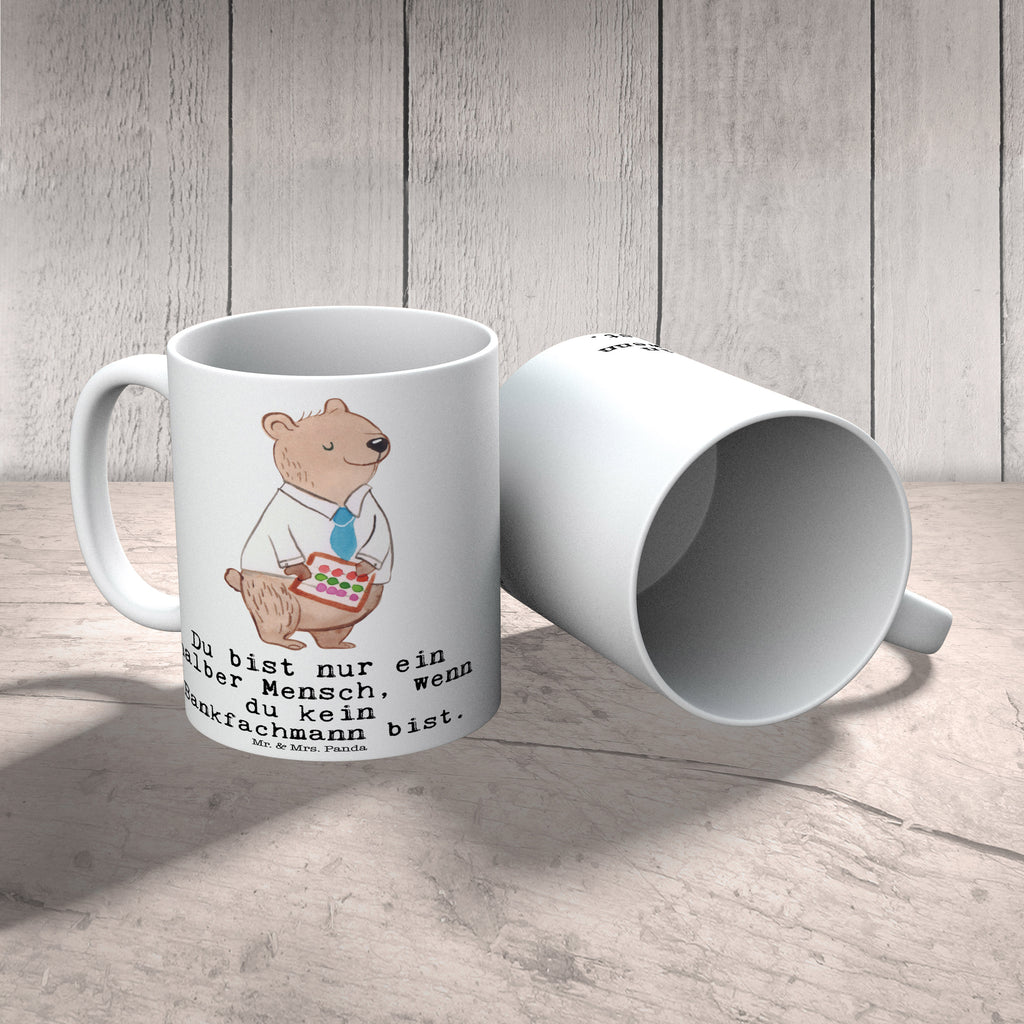 Tasse Bankfachmann mit Herz Tasse, Kaffeetasse, Teetasse, Becher, Kaffeebecher, Teebecher, Keramiktasse, Porzellantasse, Büro Tasse, Geschenk Tasse, Tasse Sprüche, Tasse Motive, Kaffeetassen, Tasse bedrucken, Designer Tasse, Cappuccino Tassen, Schöne Teetassen, Beruf, Ausbildung, Jubiläum, Abschied, Rente, Kollege, Kollegin, Geschenk, Schenken, Arbeitskollege, Mitarbeiter, Firma, Danke, Dankeschön, Bankfachmann, Bankangestellter, Bänker, Bankberater