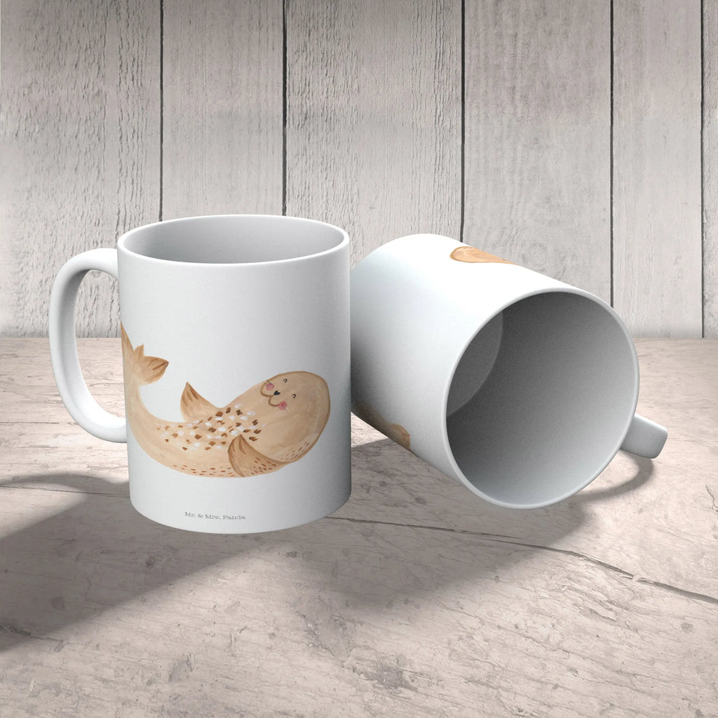 Kindertasse Robbe Liegen Kindertasse, Kinder Tasse, Kunststoff Tasse, Kindergarten Tasse, Trinkbecher, Camping Becher, Kaffeetasse, Kunststoffbecher, Kindergartenbecher, Outdoorgeschirr, Kunststoffgeschirr, Reisebecher, Reisetasse, Kinderbecher, Bruchfeste Tasse, Bruchsichere Tasse, Plastik Tasse, Plastiktasse, Tiermotive, Gute Laune, lustige Sprüche, Tiere, Robbe, Robben, Seehund, Strand, Meerestier, Ostsee, Nordsee, Lachen, Freude