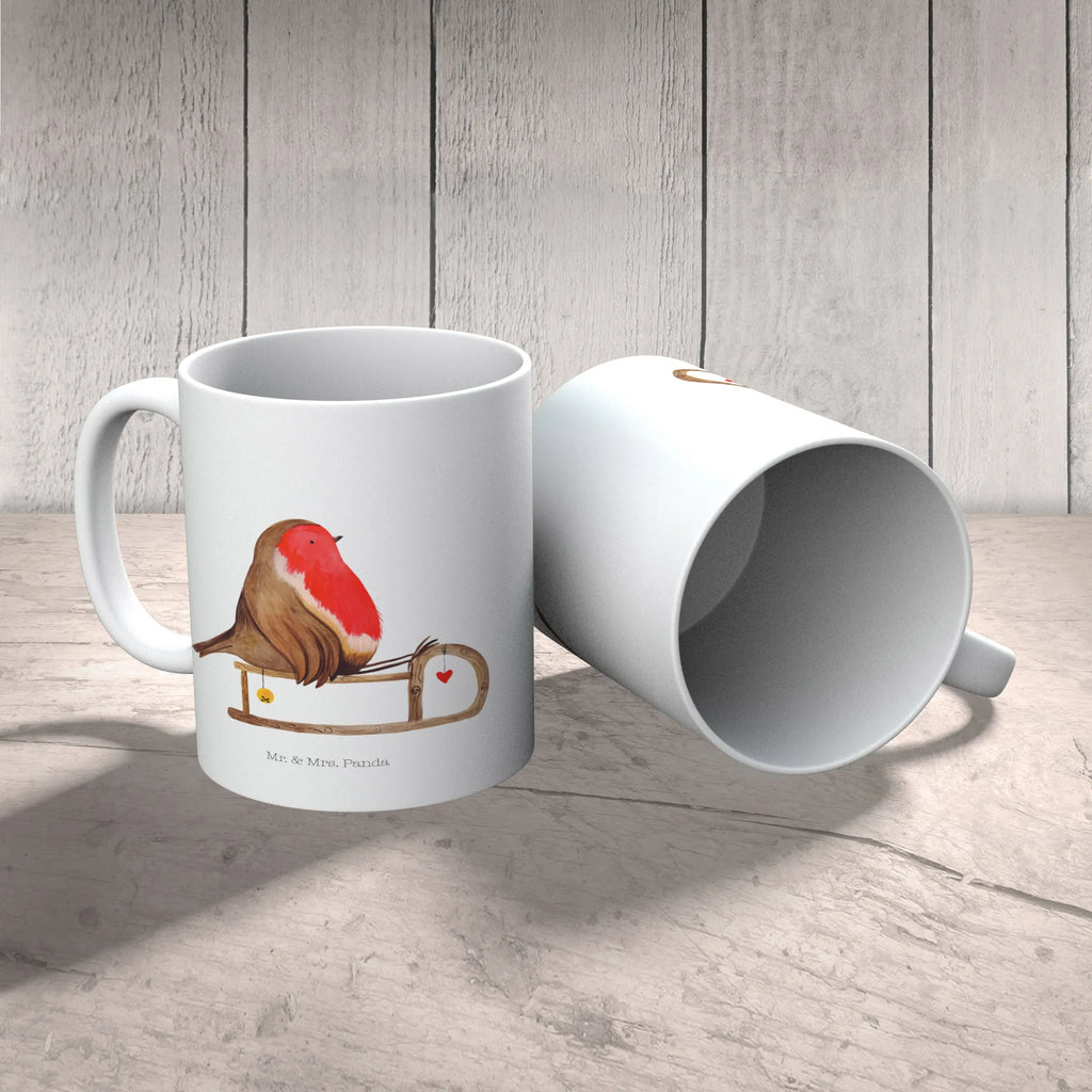 Tasse Rotkehlchen Schlitten Tasse, Kaffeetasse, Teetasse, Becher, Kaffeebecher, Teebecher, Keramiktasse, Porzellantasse, Büro Tasse, Geschenk Tasse, Tasse Sprüche, Tasse Motive, Kaffeetassen, Tasse bedrucken, Designer Tasse, Cappuccino Tassen, Schöne Teetassen, Winter, Weihnachten, Weihnachtsdeko, Nikolaus, Advent, Heiligabend, Wintermotiv, Schlitten, Vogel